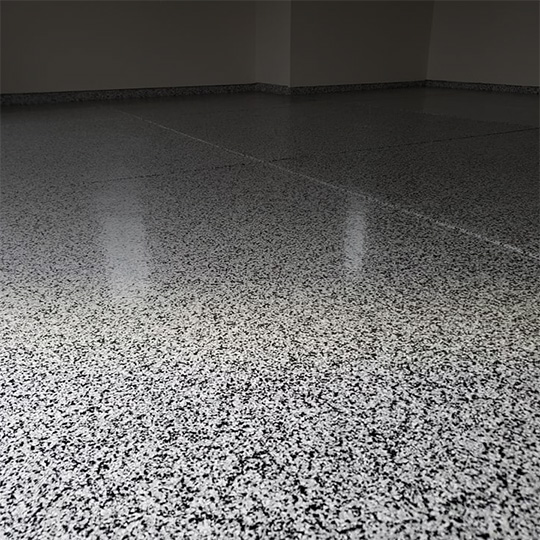 Garage With Black And White Flake Floor